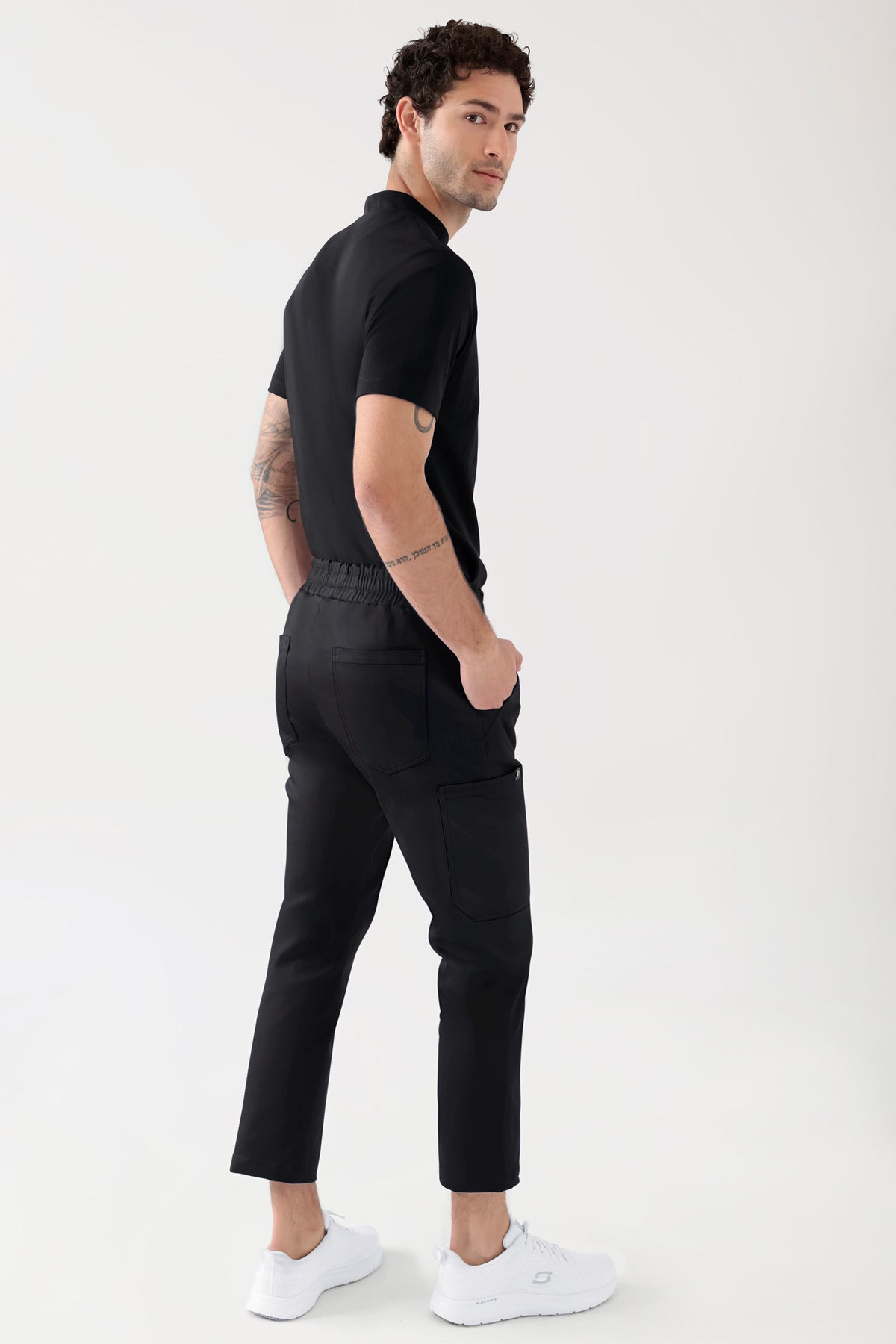 COMFY FLEX Stretch Hose Unisex - 7/8 Länge schwarz, Vue de dos Le mannequin mesure 188 cm et porte la taille M